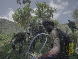 Satgas Yonif 715/Motuliato Bangun Bak Penampungan Air